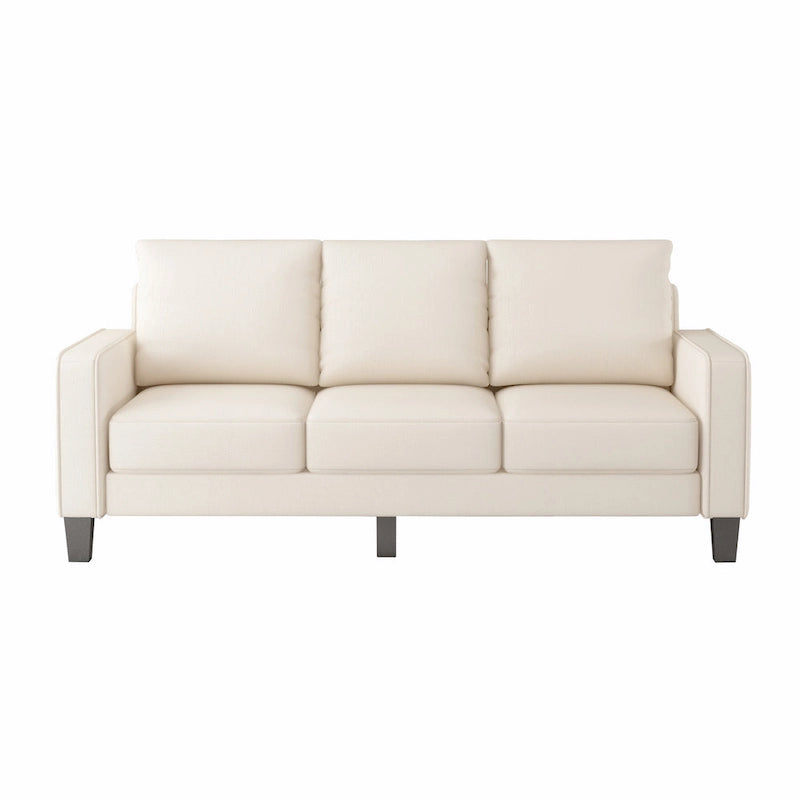 Beige stoffen bank met rechte armleuningen en gecapitonneerde rugleuning