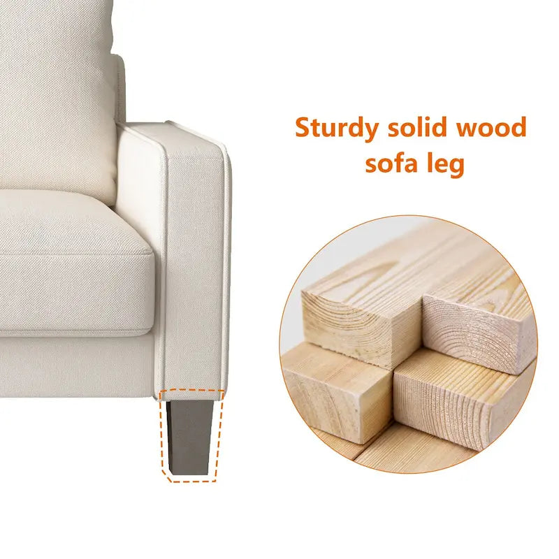 Beige stoffen bank met rechte armleuningen en gecapitonneerde rugleuning